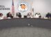 Orange Unified School District Board of Education members seated at the dais during the October 15, 2026 board meeting, with the district seal and a Golden Bell Awards banner behind them.